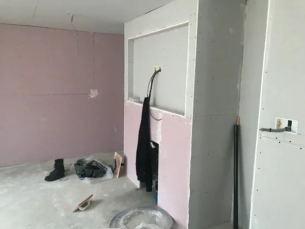 Media wall framed and boarded with the screen recess set out before anything is skimmed