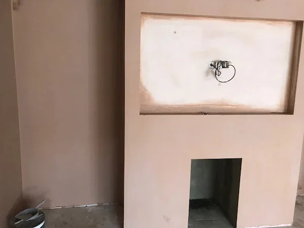 Media wall with the screen recess above and the fire opening below