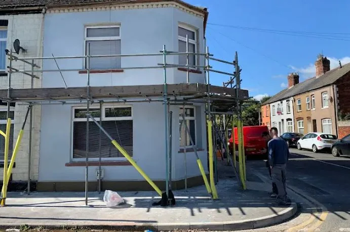 The same corner terrace with the render finished, before the scaffold came down