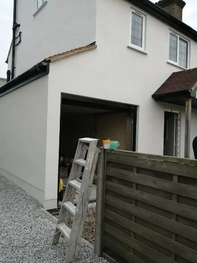 Front elevation and garage rendered white