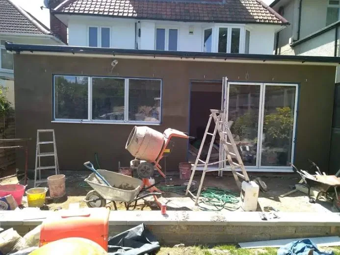 Mixer running in the back garden while the rear elevation is rendered