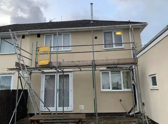 Semi-detached house rendered out with the scaffold still up