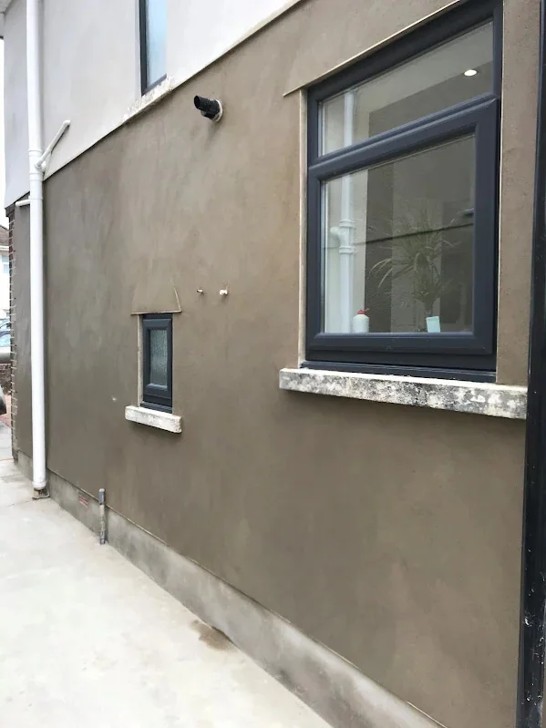 Side elevation rendered in a dark finish, cut round the cills cleanly