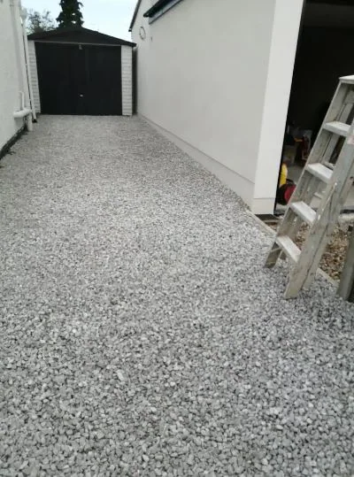 Side return rendered white above a resin-bound path