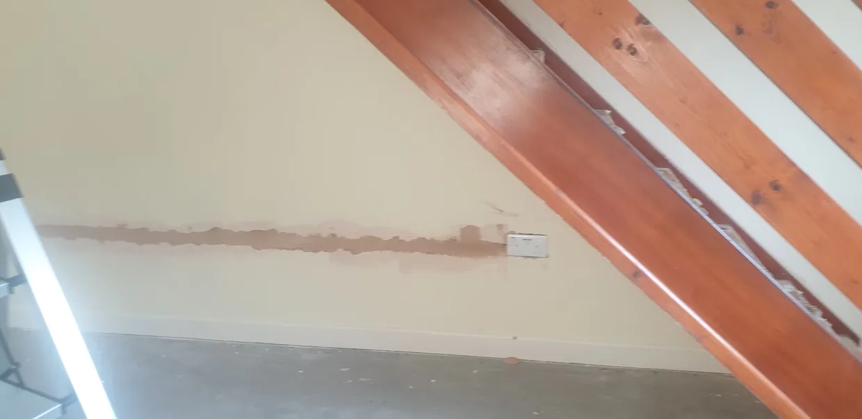 Ceiling boarded and skimmed neatly between exposed timber beams