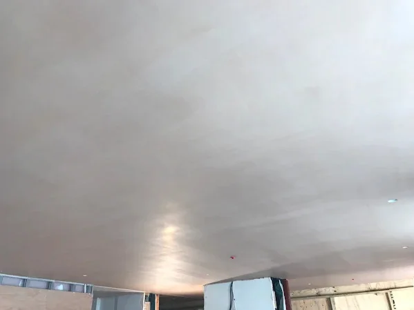 Large ceiling skimmed flat, the downlights cut in afterwards