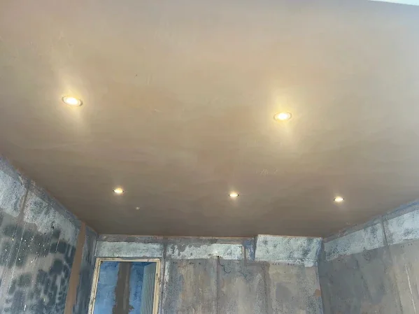 Ceiling skimmed with the downlights cut back in, the walls still to do
