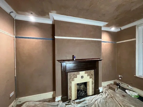 Period room skimmed around the original fire surround, picture rail and cornice left proud