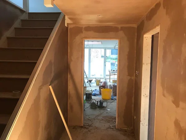 Hallway and stairs skimmed out, looking through to the back of the house