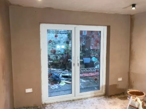 Sitting room skimmed around new French doors, reveals and head run in straight