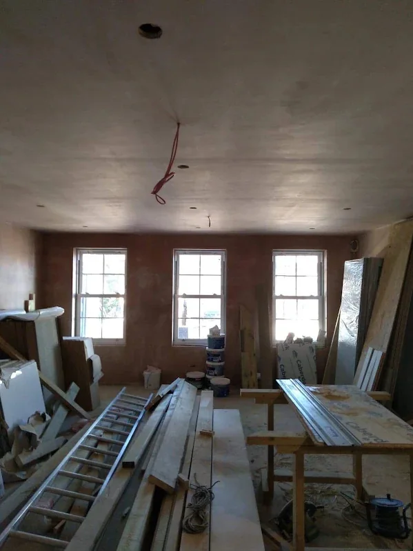 Room skimmed around a three-light window with the ceiling done in the same visit