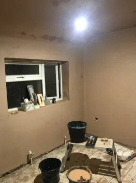 Small bedroom skimmed out, ceiling light fitted, tools still on the floor