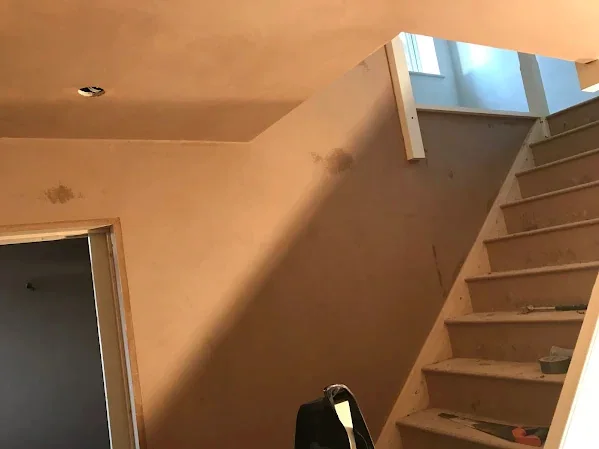 Stairwell skimmed from the treads up to the rooflight, the doorway head run in square