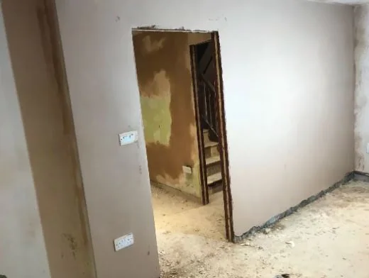 Before: old finish off the walls with a doorway opened up